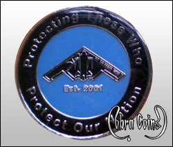 Shiny round custom challenge coin with a bomber in the center. Cobracoins.com Cobra Coins